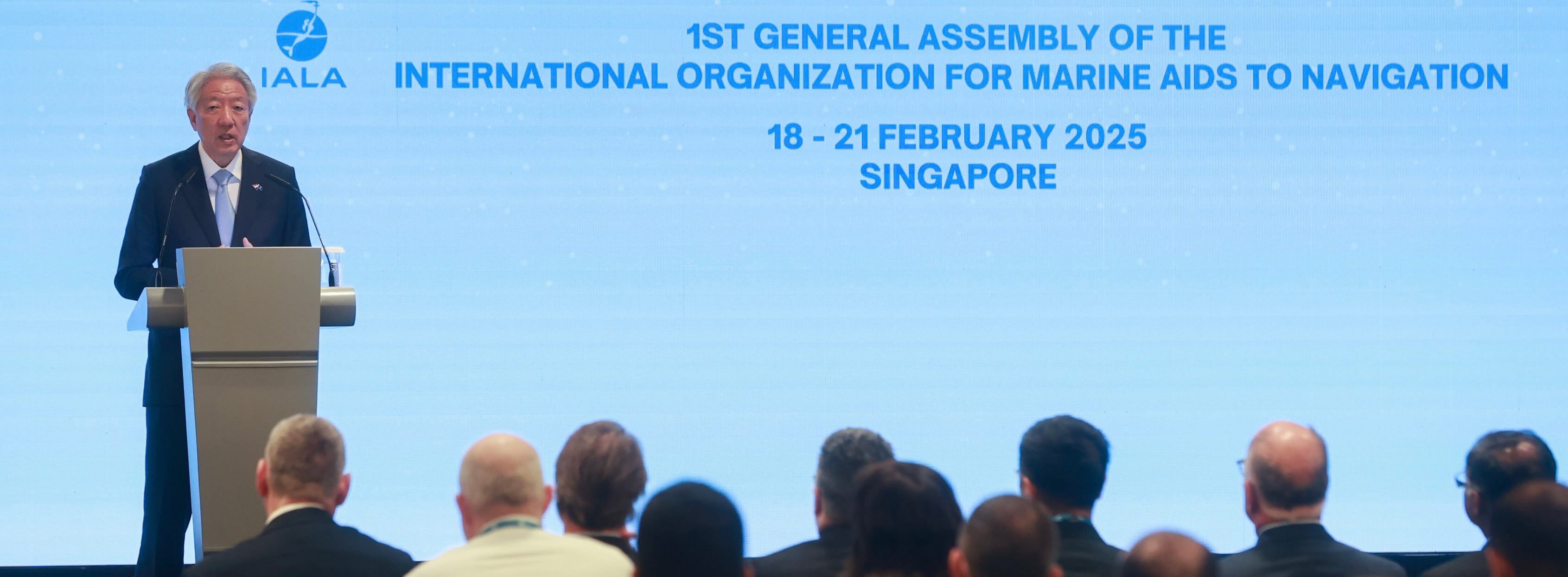 Speaker at IALA conference, 18-21 Feb 2025, Singapore, audience visible.